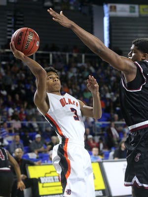 Blackman junior Donovan Sims elevates for a shot during Friday's semifinal loss to Memphis East.