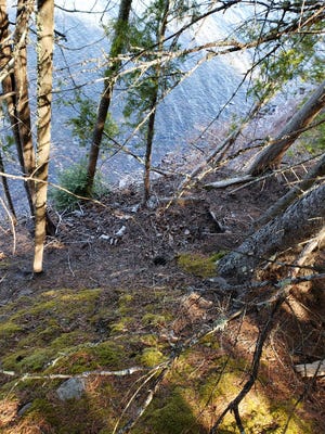 A look down from the top of the cliff, to the Lake Superior shoreline below, where two Michigan conservation officers rescued a Baraga County woman May 3 near L'Anse, Michigan.