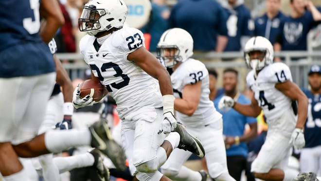 Penn State Ayron Monroe carries the ball after intercepting a pass in the first half of Penn State's Blue-White Game Saturday, April 22, 2017, at Beaver Stadium. The Nittany Lions, now the defending Big 10 champions and fresh off a Rose Bowl appearance, kicked off their annual spring football scrimmage at 3 p.m.