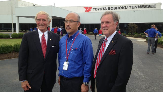 Kimihiko Sumino, president of Toyota Boshoku Tennessee, center, stands with Jackson Mayor Jerry Gist, left, and Madison County Mayor Jimmy Harris after a ribbon cutting Thursday at Toyota Boshoku Tennessee.