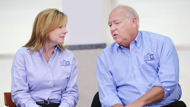 Following the ceremonial handshake between General Motors and United Auto Workers Monday, July 13, 2015 at the UAW-GM Center for Human Resources in Detroit, General Motors President  Mary Barra, left,  chats with UAW President Dennis Williams as they prepare to take questions from the media.