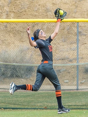 Aztec's Trinity Pollock catches a fly ball in left field during an April 7 game at the Farmington Sports Complex.