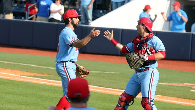 Parker Caracci (left) recorded his fifth save in seven games against Arkansas Sunday.