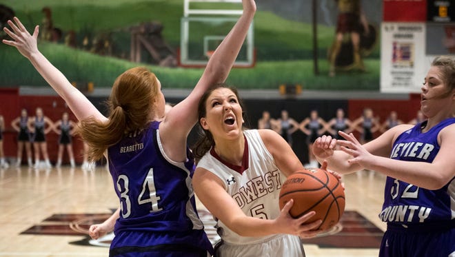Morristown West’s Blayre Shultz attempts to score past Sevier County's Savannah Fox, left, and Faith Muse on Tuesday.