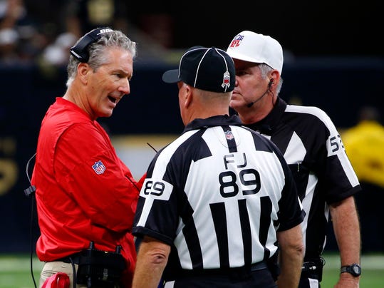 Tampa Bay Buccaneers head coach Dirk Koetter talks to the officials in the second half of an NFL football game against the New Orleans Saints in New Orleans, Sunday, Nov. 5, 2017. (AP Photo/Butch Dill)