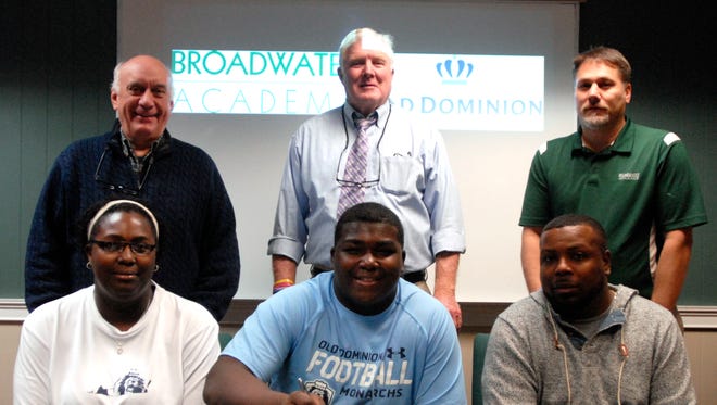 Broadwater senior Dontae Weatherly, bottom row second from left, poses after signing his letter of intent to play football at Old Dominion University Wednesday, Feb. 3, 2016. Also pictured, bottom row from left, Weatherly's mother Danielle, Weatherly, Weatherly's father David; second row from left, Headmaster Joe Spagnolo, Head Football Coach Noble Palmer and Athletic Director Ron Anson. 