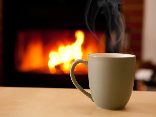 A cup of hot cocoa by the fire