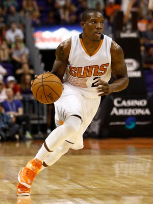 Eric Bledsoe drives against the Denver Nuggets during preseason action on Friday, Oct. 10, 2014 at US Airways Center in Phoenix.