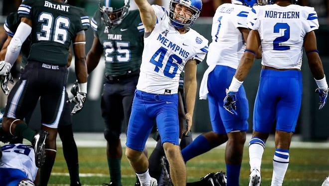 University of Memphis kicker Jake Elliott (46) celebrates a Tigers' onside kick recovery against Tulane University during first-quarter action at Yulman Stadium in New Orleans.