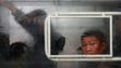 A commuter is seen through a tram window in Pyongyang