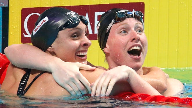 Lilly King (right) celebrates her gold medal in the women's 100-meter breaststroke at the World Aquatics Championships in Budapest, Hungary in 2017, along with teammate Katie Meili (left), who won the silver. King will be a special guest at the Night of Memories Saturday at the Vanderburgh 4-H Center.