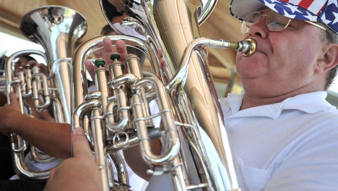 Carlyle Weber of the Stuart Community Band plays. This image was originally taken in 2012.