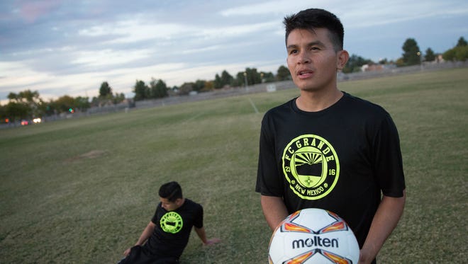 Alexis Ruiz, right, founder of FC Grande Soccer club, talks about the soccer club, while teammate Alexis Rivera, left, stretches Monday, November 13, 2017 at the Soldados Multi Use Complex. FC Grande recently became a member of the United Premier Soccer League and starts play next spring.