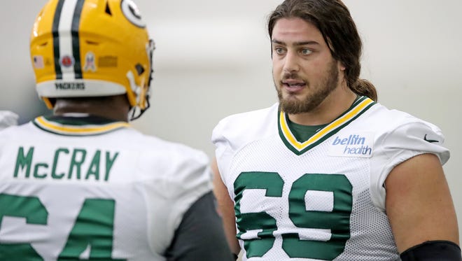 Green Bay Packers offensive tackle David Bakhtiari (69) talks blocking techniques with offensive guard Justin McCray (64) during practice inside the Don Hutson Center Wednesday, November 15, 2017 in Ashwaubenon, Wis.