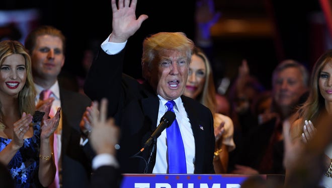 Republican presidential candidate Donald Trump waves after speaking in New York on May 3, 2016, following the primary in Indiana.