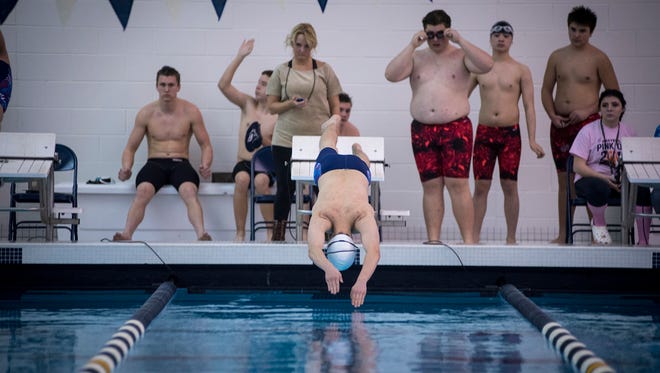 Port Huron Northern High School swimmer Michael Jowan dives into the pool at the start of the Boys 50 yard Freestyle race at the ForSports Blue Water Classic swim meet at Marysville High School Jan. 25.
