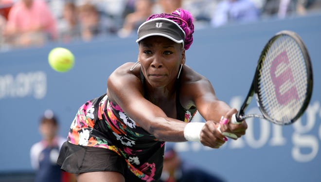 Venus Williams of the USA chases down a backhand during her victory Monday against Kirsten Flipkens of Belgium.