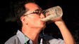 A North Korean man gulps down a glass of draft beer