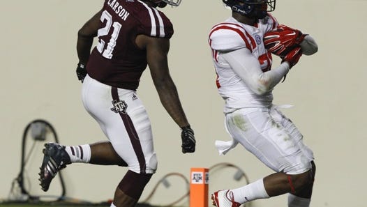 Ole Miss linebacker Keith Lewis returns a fumble recovery for a touchdown against Texas A&M.