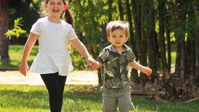 
Glenda Rigby’s children, Sarah and Sonny, play on the grounds at the Healthy Start Coalition of Brevard office in Rockledge.
