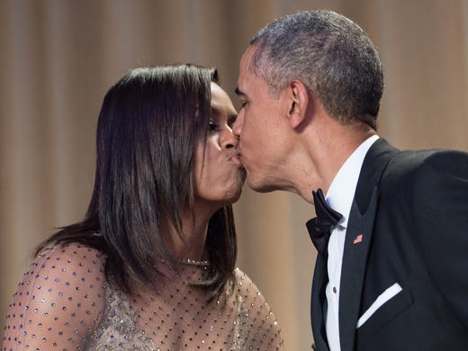 President Obama kisses his wife Michelle after speaking