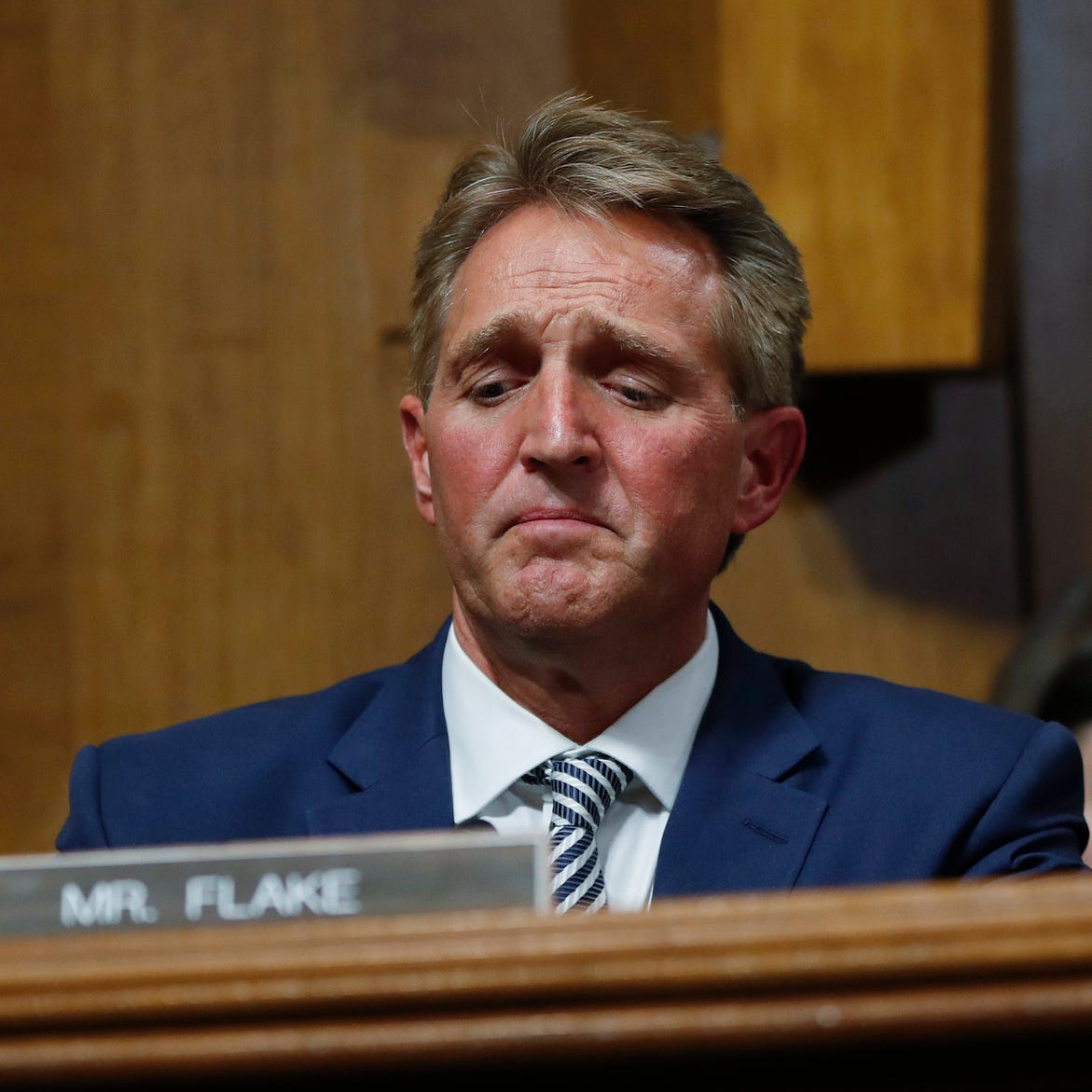 After a flurry of last-minute negotiations, the Senate Judiciary Committee advanced Brett Kavanaugh's nomination for the Supreme Court after agreeing to a late call from Sen. Flake, seated here, for a one week investigation into sexual assault allega