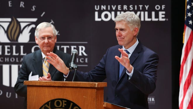 Neil Gorsuch, associate justice of the Supreme Court of the United States, acknowledges the applause just before making remarks during the McConnell Center’s Distinguished Speakers Series at the University of Louisville.  Senator Mitch McConnell looked on in the background.
Sep. 21, 2017