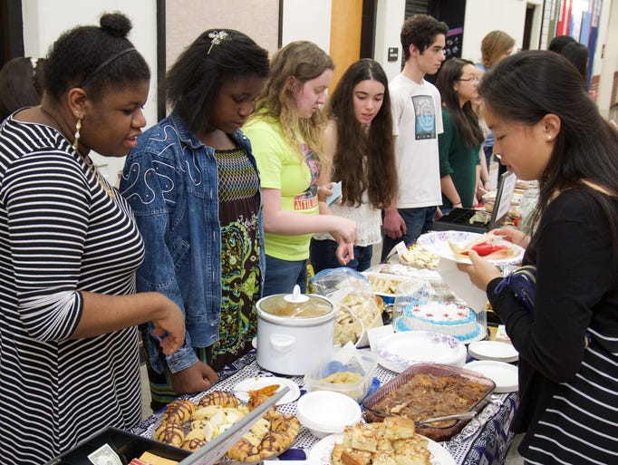 Members of the Riverside High School Atlas club hold