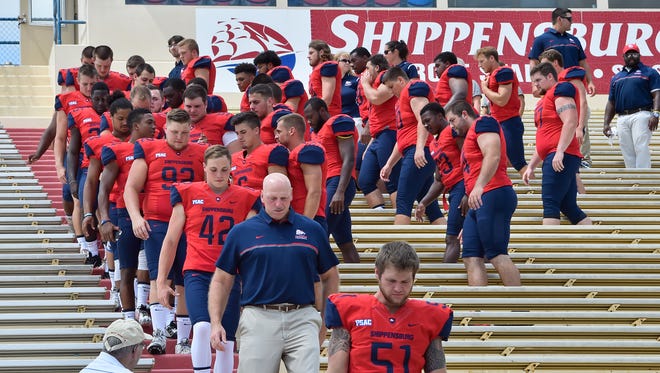 Shippensburg University's football team disperses after taking its annual team photo at media day on Saturday.