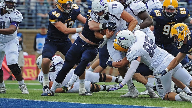 USF quarterback Luke Papilion (15) pushes through to the end zone for a touchdown during a game against Augustana Saturday, Oct. 1, 2016, at Kirkeby-Over Stadium on the Augustana University campus in Sioux Falls. 