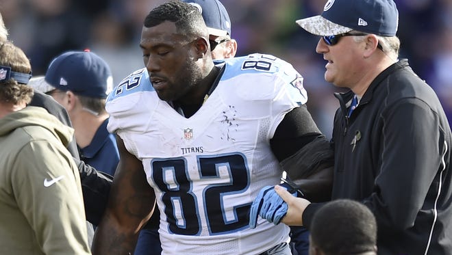 Titans tight end Delanie Walker is helped off the field after suffering a concussion during last Sunday's game against the Ravens.