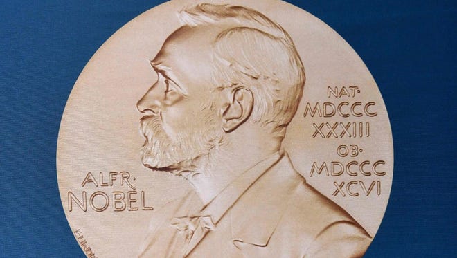 A portrait of Swedish inventor and scholar Alfred Nobel can be seen on the speaker's desk at the Nobel Forum in Stockholm, prior to the announcement of the Nobel Prize in Medicine on October 3.