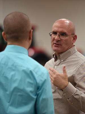 Richmond Mayor Dave Snow, left, and Wayne County Chamber of Commerece President and CEO Phil D'Amico talk during the annual Wayne County Urban Rural dinner Tuesday, March 28, 2017 at the Kuhlman Center on the Wayne County Fairgrounds in Richmond.