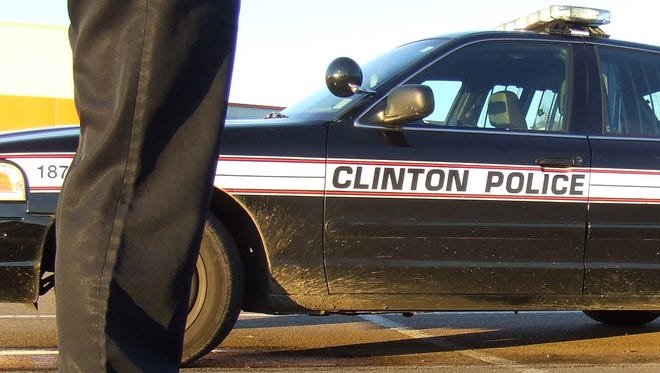 This is a photo illustration showing a Clinton police officer.