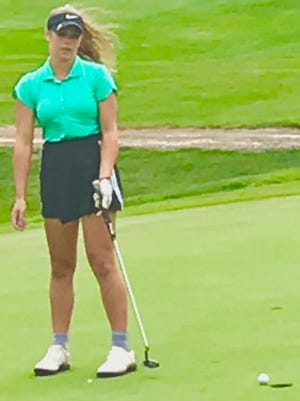 Amanda Ruminski tries to coax her putt into the hole during Tuesday's round of the Richland County Junior Golf Tournament.