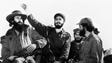 Cuban rebel leader Fidel Castro is surrounded by members