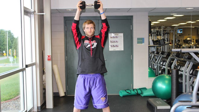 Hold a medium to light dumbbell at chest height and  lift.