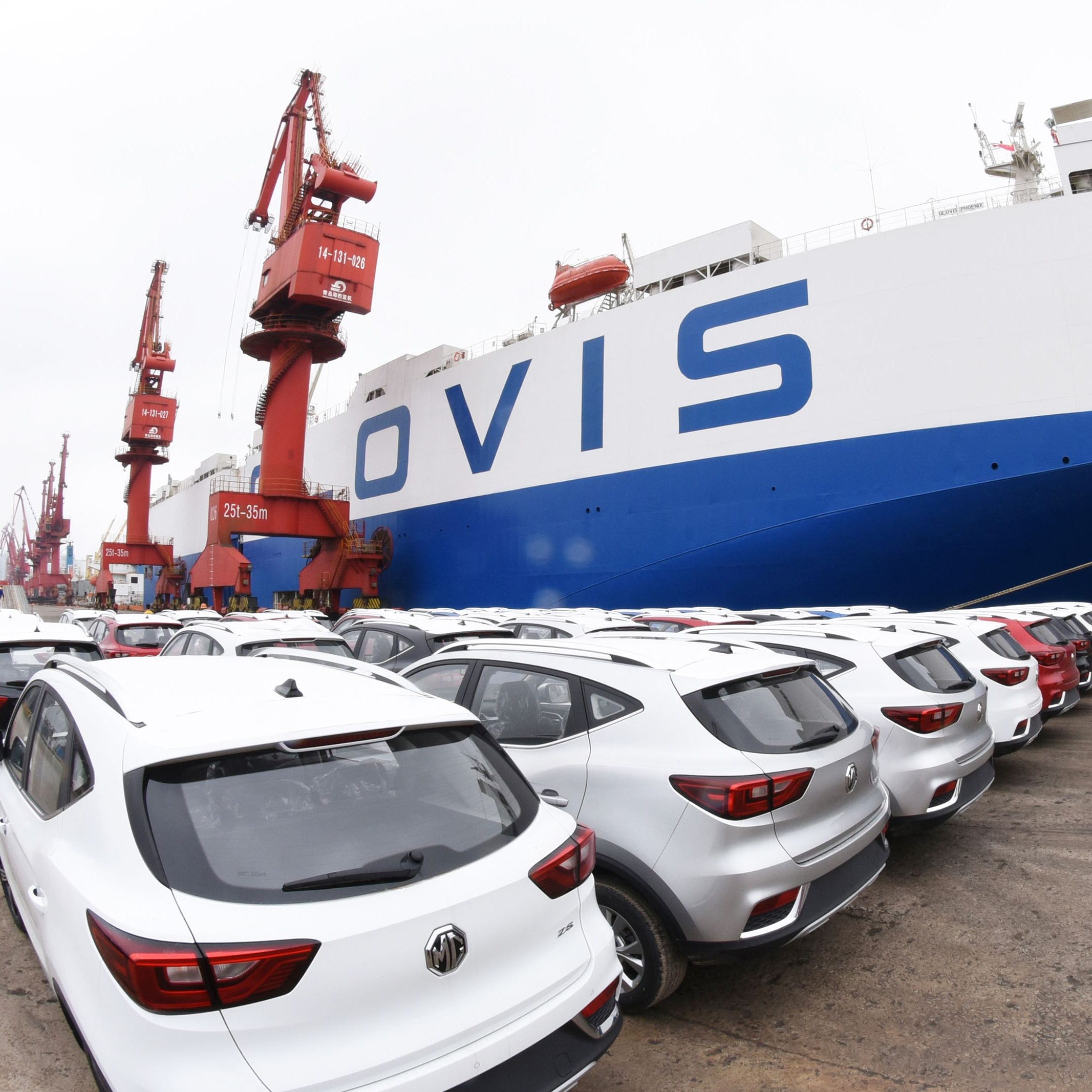 MG cars produced by SAIC Motor Corp (Shanghai Automotive Industry Corporation) waiting to be exported to the US at a port in Lianyungang in China's eastern Jiangsu province on May 26, 2018.  US President Donald Trump's threat to impose steep tariffs on auto imports will hit foreign automakers that export a large number of vehicles to the US market, but many also manufacture cars domestically. AFP PHOTO