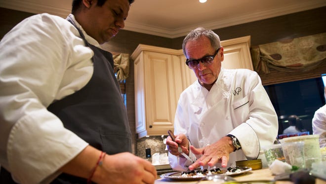 Wolfgang Puck prepares an amuse-bouche for the cocktail hour of the "Sun, Moon and Stars" vintner dinner hosted by Usha & Monte Ahuja with Joan & Bob Clifford in Naples, Florida on Friday, Jan. 27, 2017. This intimate, exclusive dining experience was illuminated by the expertise of two renowned vintners and the culinary talents of the celebrity chef.  