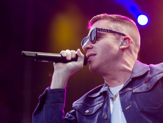 Macklemore performs with Ryan Lewis during the March