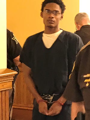 Acquitted murder suspect Darius Printup arrives at the Tippecanoe County Courthouse Wednesday morning to plead guilty to leaving the scene of a traffic accident, false informing and a learner's permit violation.