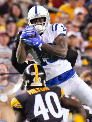 Indianapolis Colts wide receiver Phillip Dorsett (15) makes a catch above Pittsburgh Steelers defensive back Mike Hilton (40) during the first half of an NFL preseason football game, Saturday, Aug. 26, 2017, in Pittsburgh. (AP Photo/Don Wright)