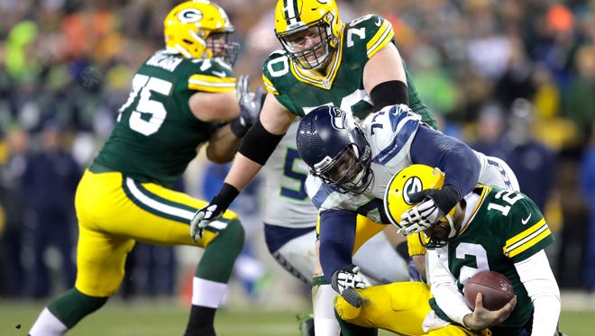 Seattle Seahawks' Ahtyba Rubin sacks Green Bay Packers' Aaron Rodgers in th third quarter.
The Green Bay Packers host the Seattle Seahawks on Sunday, November 11, 2016, at Lambeau Field in Green Bay, Wis.