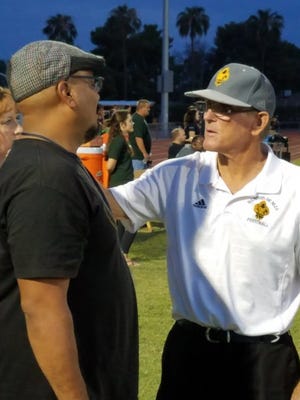 After a cancer diagnosis Marcos de Niza's coach Paul Moro is on the sidelines and meets with a fan prior to their game vs. Peoria on September 8, 2017.