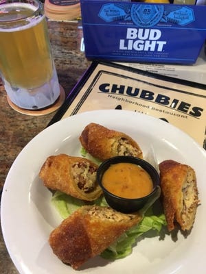 Chubbies jalapeno eggrolls were golden fried wonton wrappers encasing a triple blend of rich cheeses studded with smoky bacon and a kick of jalapenos. They were served with sweet chili dipping sauce.