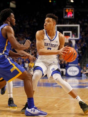 Kentucky Wildcats forward Kevin Knox (5) passes the ball against the Morehead State Eagles in the first half at Rupp Arena.