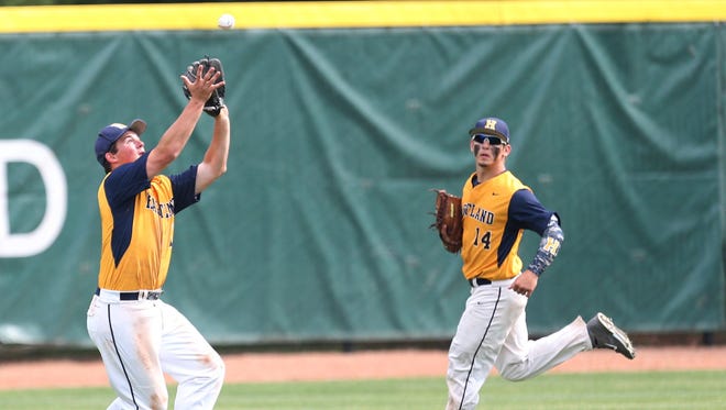 Hartland's Richard Bortle catches a fly ball during the Division 1 MHSAA State Semifinal on Thursday. Hartland won the title Saturday over Portage, 2-1 in 10 innings.