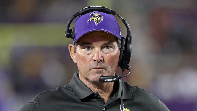 Minnesota Vikings head coach Mike Zimmer looks on during the third quarter against the Oakland Raiders at TCF Bank Stadium.