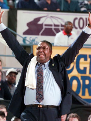 Georgetown head coach John Thompson yells to his players during the second half of the first round NCAA action at the Richmond Coliseum Friday, March 15, 1996, in Richmond, Va.  The Hoyas won 93-56. Thompson's death was announced Monday August 31, 2020. The retired Georgetown coach was 78.