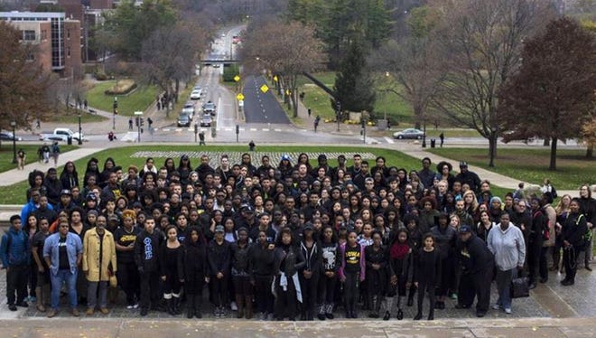 About 200 members of the University of Iowa community gathered Wednesday to show solidarity with students at the University of Missouri.